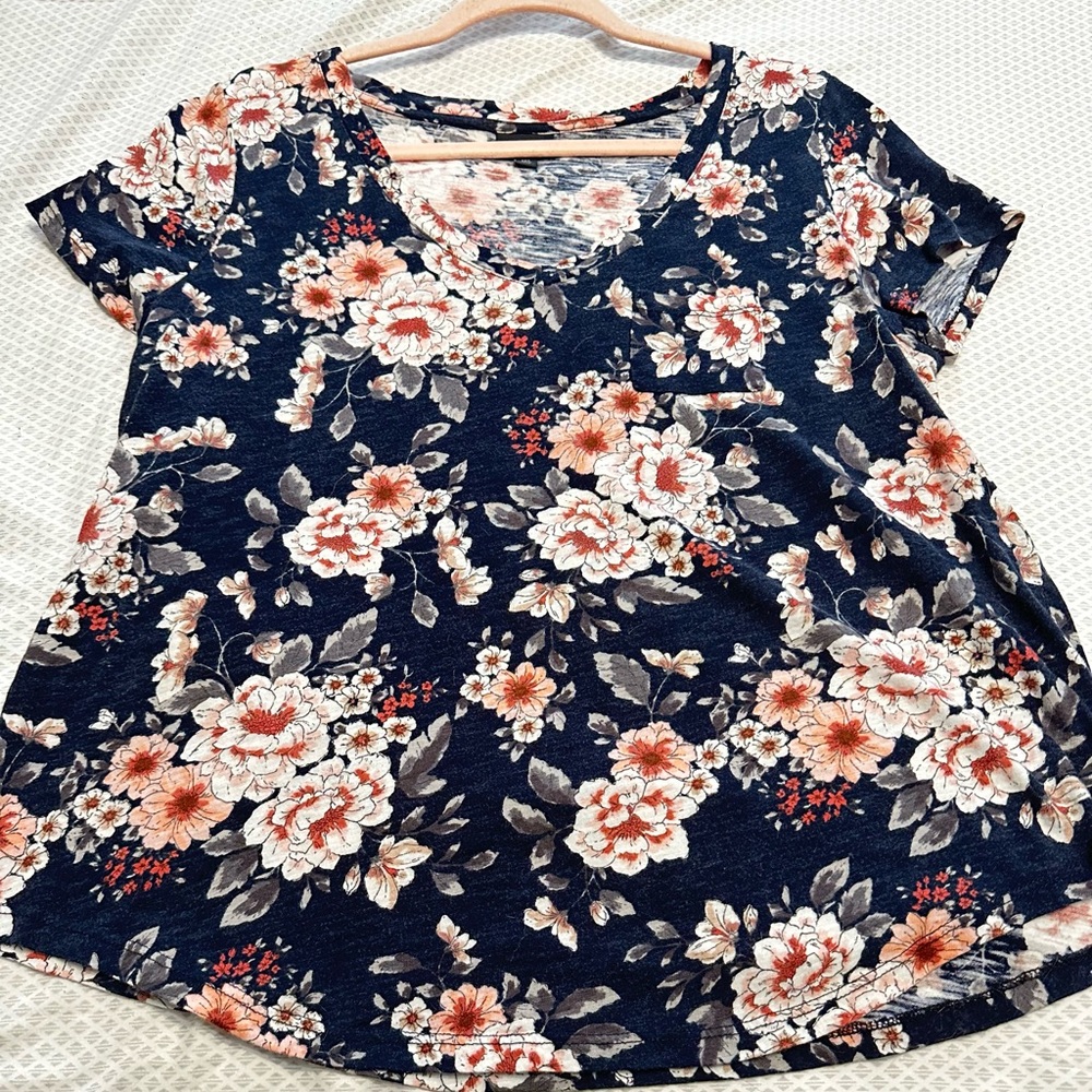 Floral tee shirt with pocket.